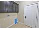 Laundry room with cabinets and door at 1580 S Tiptop Trl, Pahrump, NV 89048