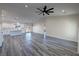 Large living room featuring gray flooring, large ceiling fan and recessed lighting at 1580 S Tiptop Trl, Pahrump, NV 89048