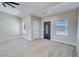 Comfortable living room featuring abundant natural light and stylish wood-look floors at 1580 S Tiptop Trl, Pahrump, NV 89048