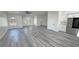 Open floor plan living room with hardwood floors and natural light at 1580 S Tiptop Trl, Pahrump, NV 89048