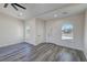 Living room featuring ceiling fan, recessed lighting, gray flooring and arched windows at 1580 S Tiptop Trl, Pahrump, NV 89048