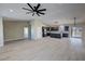 Open-concept floor plan with a view of the kitchen featuring wood look flooring and recessed lights at 1580 S Tiptop Trl, Pahrump, NV 89048