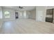 Spacious living room showcases arched windows, wood-look floors, and an open layout at 1580 S Tiptop Trl, Pahrump, NV 89048