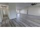 Spacious open floor plan featuring recessed lighting, ceiling fan and gray flooring at 1580 S Tiptop Trl, Pahrump, NV 89048