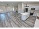 Open layout showcasing the kitchen, living area, and stylish finishes at 1580 S Tiptop Trl, Pahrump, NV 89048