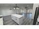 Bright and airy living space with an open layout and stylish kitchen island at 1580 S Tiptop Trl, Pahrump, NV 89048
