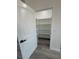 Walk-in pantry with white shelving and vinyl flooring provides ample storage at 1580 S Tiptop Trl, Pahrump, NV 89048