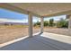 Covered patio provides a relaxing outdoor space, offering stunning views of the surrounding landscape at 1580 S Tiptop Trl, Pahrump, NV 89048