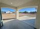Covered front porch with arched columns overlooking land at 1580 S Tiptop Trl, Pahrump, NV 89048