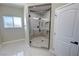 Contemporary shower with glass enclosure, patterned tile, and modern fixtures at 1580 S Tiptop Trl, Pahrump, NV 89048