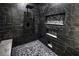 Modern shower with black marbled tile, bench seat and rainfall shower head at 1580 S Tiptop Trl, Pahrump, NV 89048