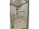 Contemporary shower with herringbone tile, rainfall showerhead, and built-in shelves at 1580 S Tiptop Trl, Pahrump, NV 89048