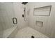 Luxurious shower featuring a rainfall showerhead and built-in shelves at 1580 S Tiptop Trl, Pahrump, NV 89048
