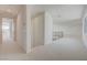 Upstairs hallway with neutral carpet, white walls, and metal railing at 1600 Pleasant Bay Ct, Henderson, NV 89011