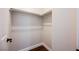A walk-in closet features laminate wood flooring, white walls, and a clothing rack at 209 Camino Vista St, Henderson, NV 89012