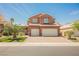 Charming two-story home with well-manicured lawn and 3 car garage at 209 Camino Vista St, Henderson, NV 89012