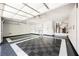 Spacious three car garage with epoxy floors and cabinet storage at 209 Camino Vista St, Henderson, NV 89012