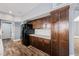 Updated kitchen features dark wood cabinets and modern appliances at 209 Camino Vista St, Henderson, NV 89012