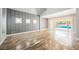 Living room with decorative wall and sliding glass doors that lead to the pool at 209 Camino Vista St, Henderson, NV 89012