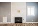 Cozy living room with decorative fireplace and white plantation shutters at 209 Camino Vista St, Henderson, NV 89012