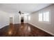 A large main bedroom with a ceiling fan, plantation shutters, and a walk-in closet at 209 Camino Vista St, Henderson, NV 89012