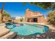 Inviting backyard pool with mature trees and landscaping at 209 Camino Vista St, Henderson, NV 89012