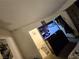 This bedroom offers an adjacent bathroom, TV, and decor at 2200 Comet Ave # D, North Las Vegas, NV 89030