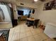 Combined dining area with stainless steel refrigerator and views to the living room at 2200 Comet Ave # D, North Las Vegas, NV 89030