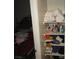 Bedroom scene includes shelves with an assortment of personal items and bedroom essentials at 2409 Maroney Ave, Las Vegas, NV 89104