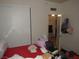 Bedroom showcasing a sliding closet door and a view into a separate room at 2409 Maroney Ave, Las Vegas, NV 89104