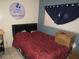 Bedroom with cozy bed, dark curtains, and birthday decorations, creating a functional and personalized space at 2409 Maroney Ave, Las Vegas, NV 89104