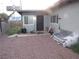 Exterior view showcasing the side of the house with a gravel ground cover at 2409 Maroney Ave, Las Vegas, NV 89104