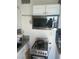 The kitchen has a stainless steel gas range and an above-range microwave at 2409 Maroney Ave, Las Vegas, NV 89104