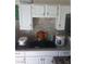 The kitchen features a double sink and white cabinetry at 2409 Maroney Ave, Las Vegas, NV 89104