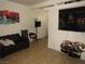 Inviting living room featuring comfortable seating, decor, and tile floors, a cozy space for relaxation at 2409 Maroney Ave, Las Vegas, NV 89104