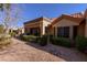 Charming home with a covered patio and well-manicured landscaping creating a peaceful outdoor space at 2437 Desert Butte Dr, Las Vegas, NV 89134