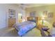 Cozy bedroom featuring a ceiling fan, carpet floors, and soft, natural light at 2437 Desert Butte Dr, Las Vegas, NV 89134