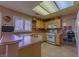 Functional kitchen featuring laminate counters, bright cabinets, and easy access to the dining area at 2437 Desert Butte Dr, Las Vegas, NV 89134