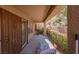 Inviting covered patio with serene outdoor seating area and lush garden views at 2437 Desert Butte Dr, Las Vegas, NV 89134