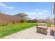 Expansive backyard featuring green grass, a patio area, and mature landscaping at 245 Hull St, Henderson, NV 89015