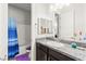 Bathroom with vanity and shower/tub combo featuring colorful decorations at 245 Hull St, Henderson, NV 89015