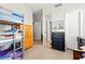 Bedroom featuring a bunk bed, neutral walls, and wood-look floors at 245 Hull St, Henderson, NV 89015