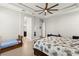 Bright bedroom with a ceiling fan and a tiled floor, and access to the bathroom at 245 Hull St, Henderson, NV 89015