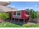 Backyard chicken coop with mature tree and grass at 245 Hull St, Henderson, NV 89015