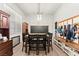 Open dining area featuring modern light fixture, built-ins and large windows at 245 Hull St, Henderson, NV 89015