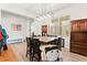 Dining area with built in storage, modern light fixtures, and large window at 245 Hull St, Henderson, NV 89015