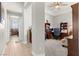 Hallway leading to an office and a bedroom with hardwood flooring throughout the home at 245 Hull St, Henderson, NV 89015