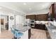 Updated kitchen boasts granite countertops, stainless steel appliances, and eat-in bar at 245 Hull St, Henderson, NV 89015