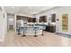 Well-appointed kitchen boasts a large island with barstool seating and stainless-steel appliances at 245 Hull St, Henderson, NV 89015