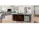Kitchen island with granite countertops, stainless steel appliances, and seamless flow into the living area at 245 Hull St, Henderson, NV 89015